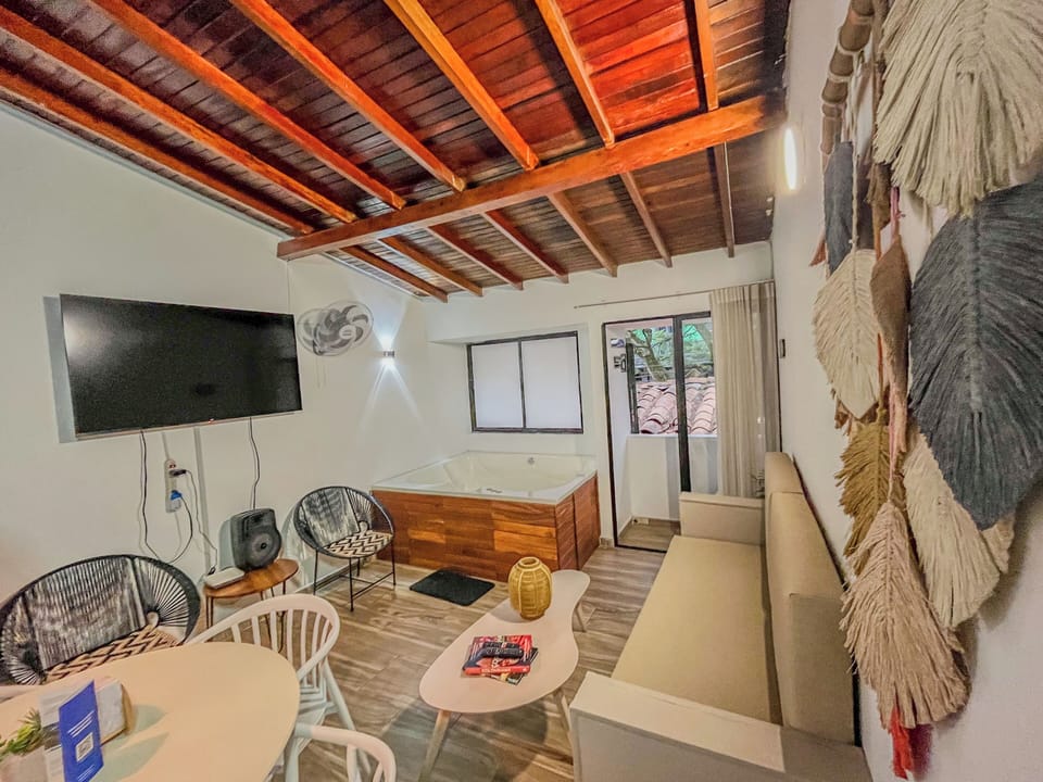 Luxury Apartment, Balcony | Living area | 32-inch flat-screen TV with cable channels