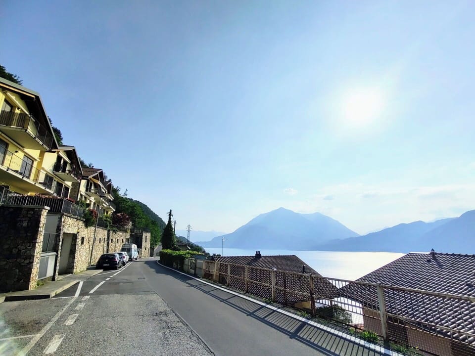 Sky, Water, Daytime, Mountain, Cloud, Building, Azure, Window, Road Surface, Highland