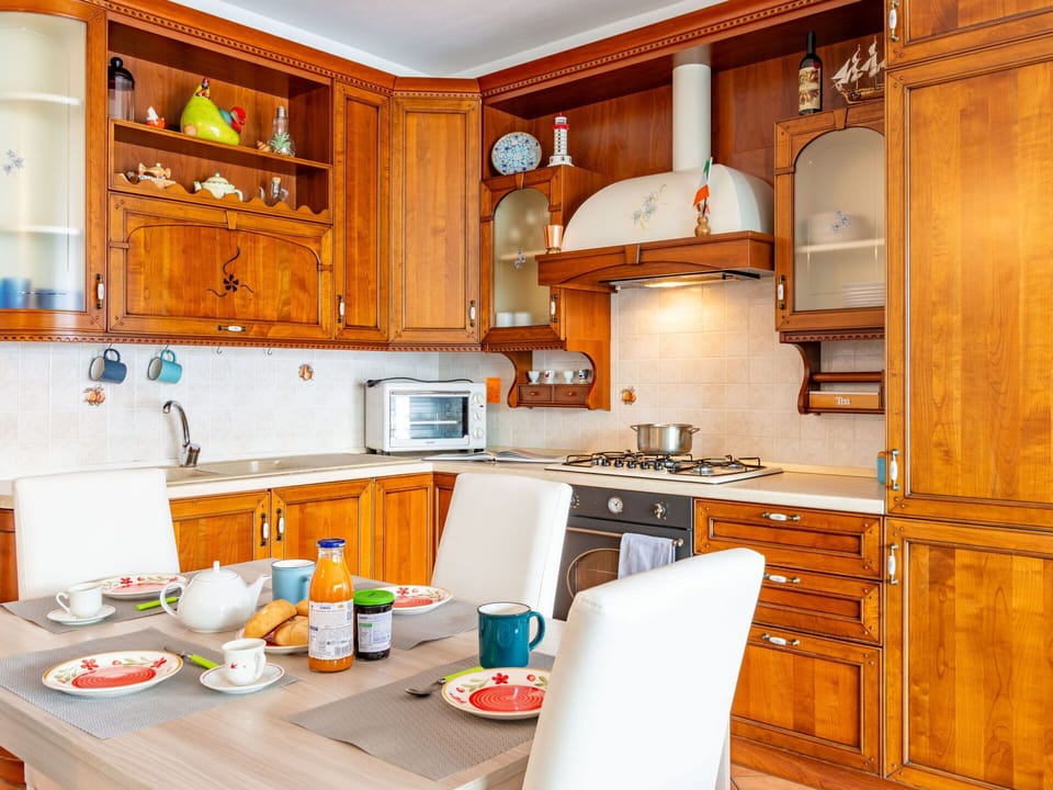 Cabinetry, Countertop, Furniture, Property, Kitchen, Kitchen Appliance, Wood, Interior Design, Kitchen Stove, Home Appliance
