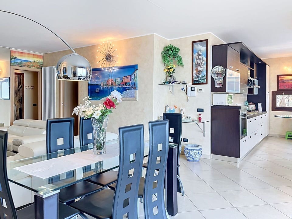 Furniture, Chair, Table, Outdoor Furniture, Outdoor Table, Kitchen & Dining Room Table, Umbrella, Shade, Restaurant, Flowerpot