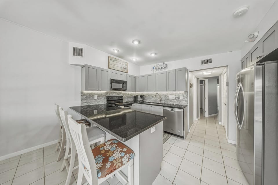 The fully equipped kitchen makes vacation dining easy, with everything you need for meals at home, plus both a Keurig and drip coffee maker for easy mornings in Key Colony Beach.