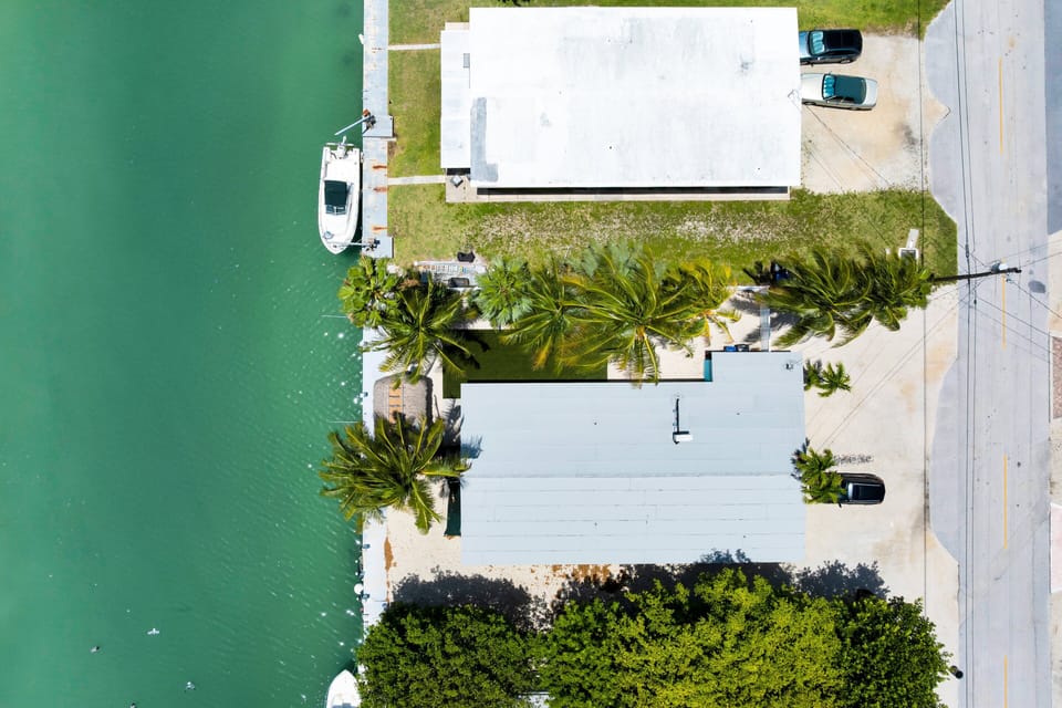 This Key Colony Beach vacation rental offers convenient parking and easy access to the home, canalfront outdoor area, and nearby Cabana Club amenities.