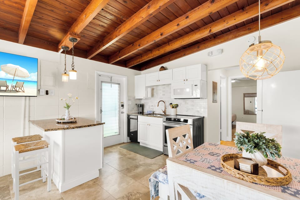 Prepare meals with ease in the full kitchen at this Key Colony Beach vacation rental, perfectly located in the heart of Marathon FL with Cabana Club access and waterfront dockage.