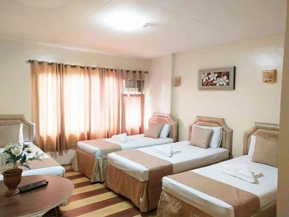 Family Quadruple Room | Desk, bed sheets