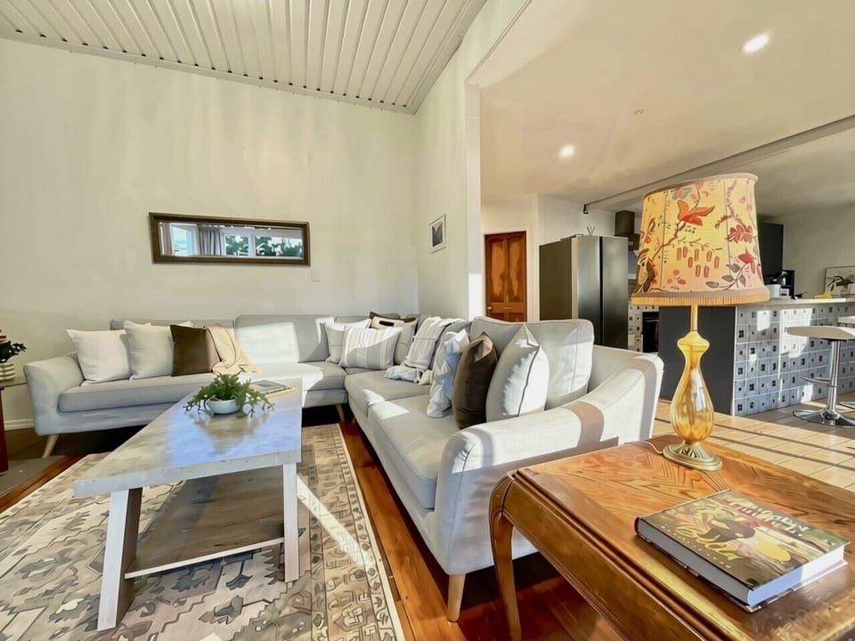 * OPEN PLAN LIVING/DINING  * LIVING ROOM- 8-person Lounge Suite + Arm Chair + Ottoman