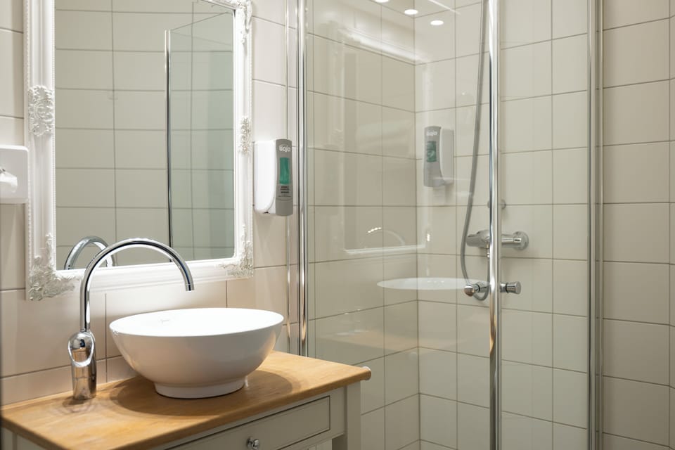 Economy Double Room | Minibar, blackout drapes, iron/ironing board, free WiFi
