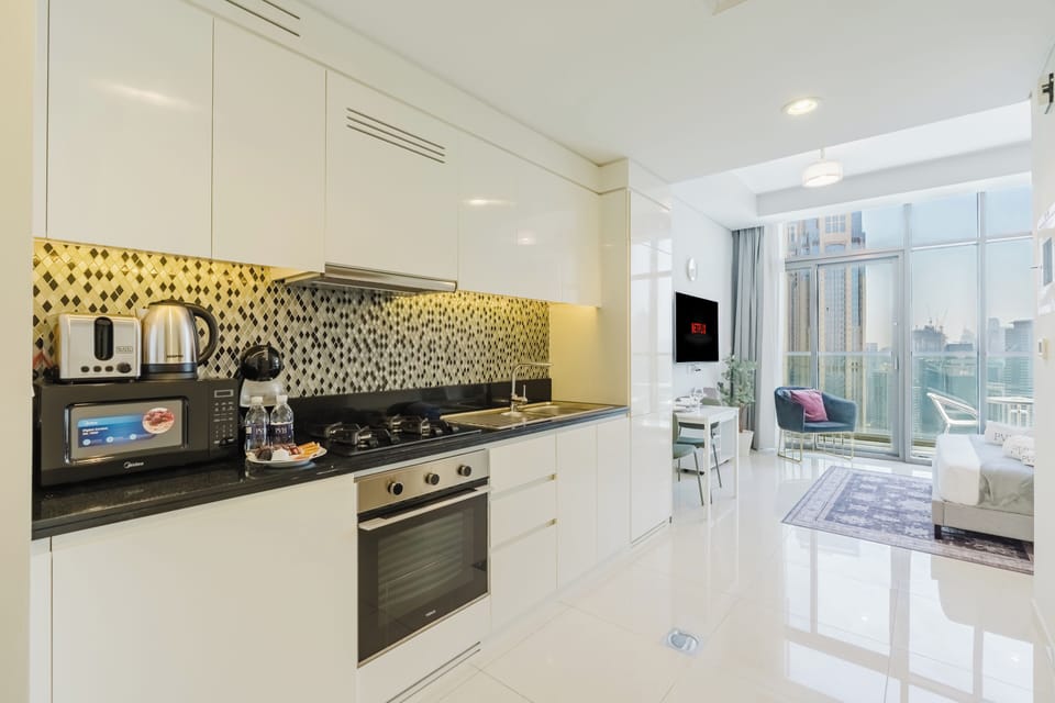 Exclusive Studio, 1 King Bed, Air conditioning, Canal View | Private kitchen | Microwave, oven, stovetop, highchair