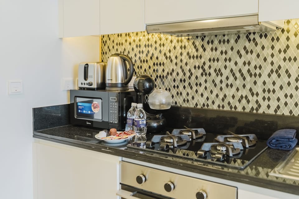 Exclusive Studio, 1 King Bed, Air conditioning, Canal View | Private kitchen | Microwave, oven, stovetop, highchair