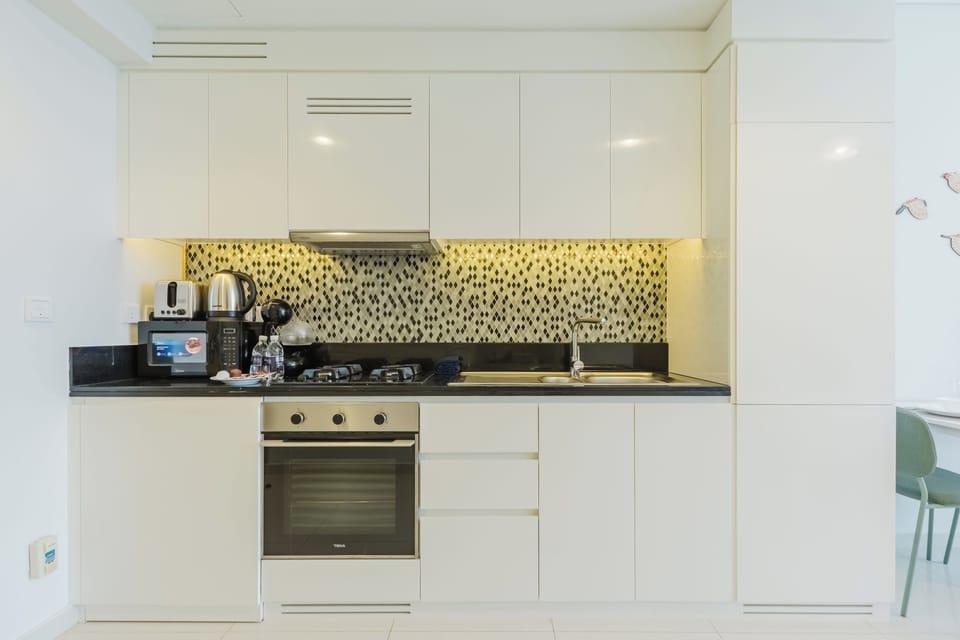 Exclusive Studio, 1 King Bed, Air conditioning, Canal View | Private kitchen | Microwave, oven, stovetop, highchair