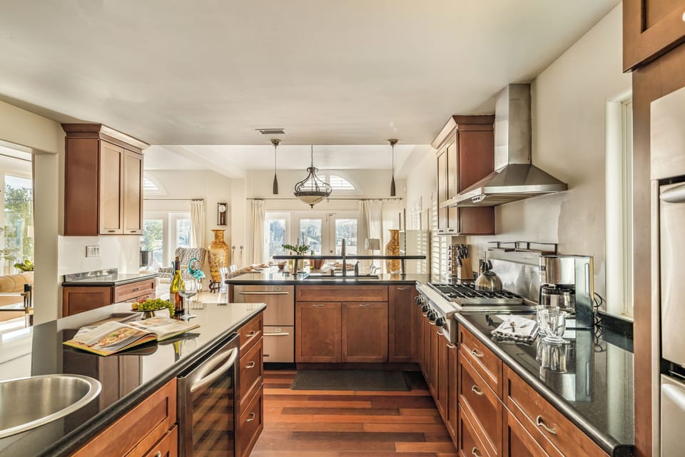 Chef-ready kitchen with spacious counters, stainless appliances, and an open layout for easy group meals.