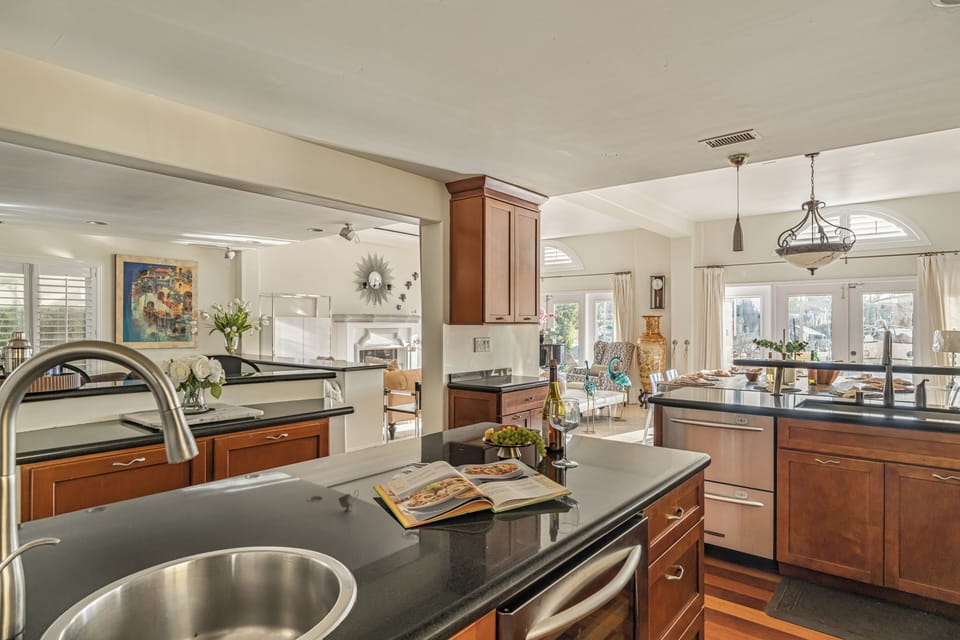 Chef-ready kitchen with spacious counters, stainless appliances, and an open layout for easy group meals.