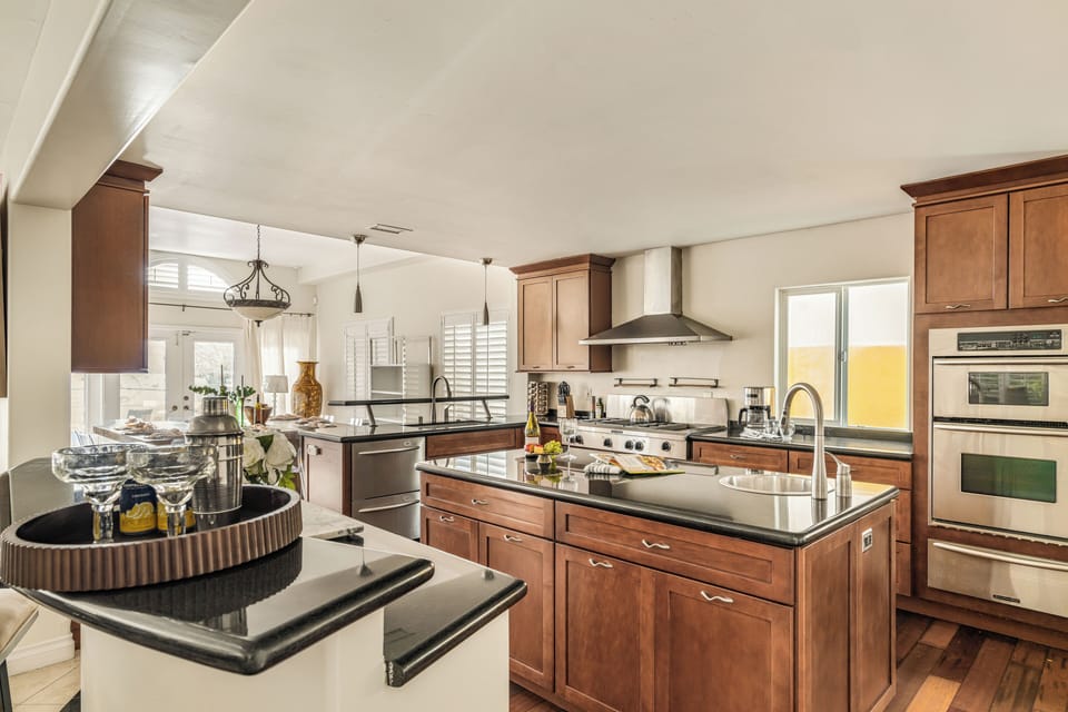 Chef-ready kitchen with spacious counters, stainless appliances, and an open layout for easy group meals.