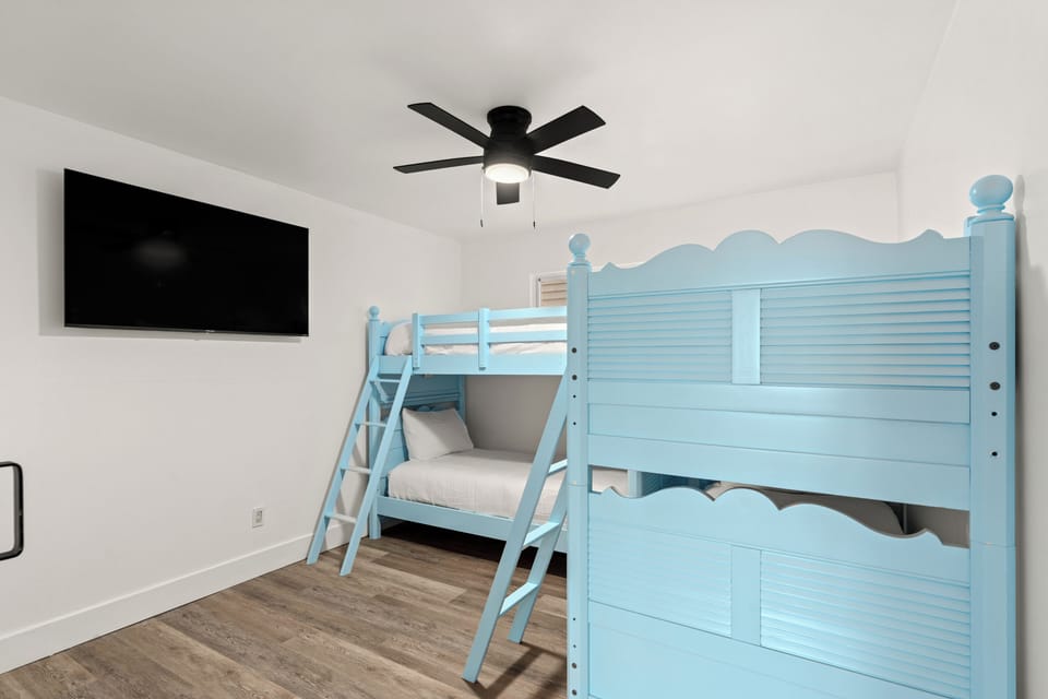 Bedroom 2 features two twin bunk beds.