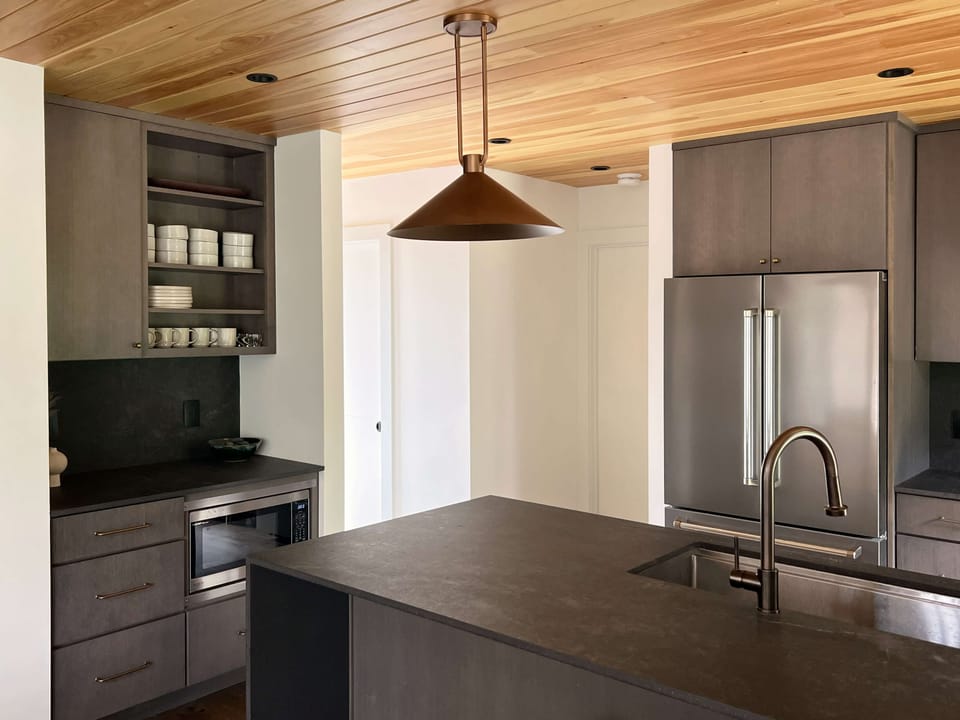 Large kitchen complete with coffee bar and appliances needed for cooking meals.
