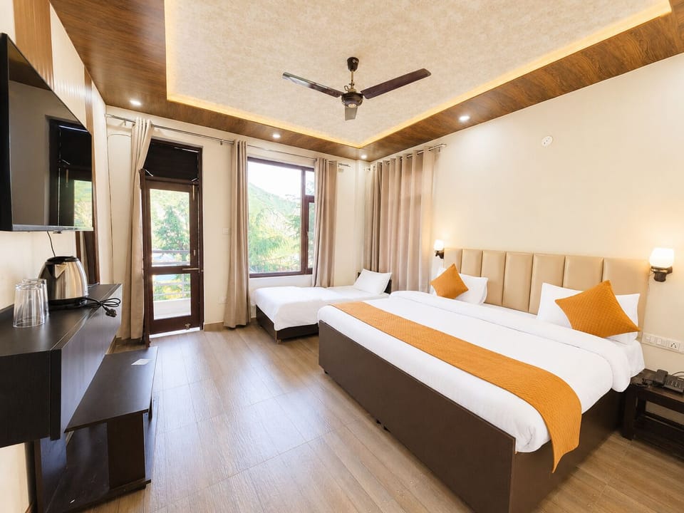 Family Suite, Balcony, Mountain View | Living area | 7-inch LED TV with satellite channels