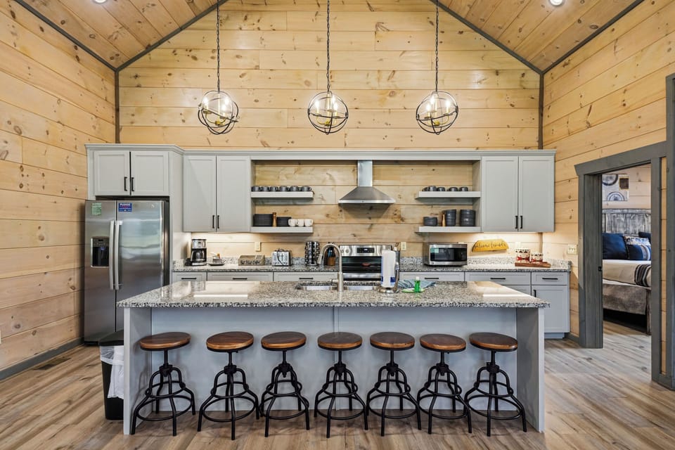 Kitchen island features bar seating for six guests