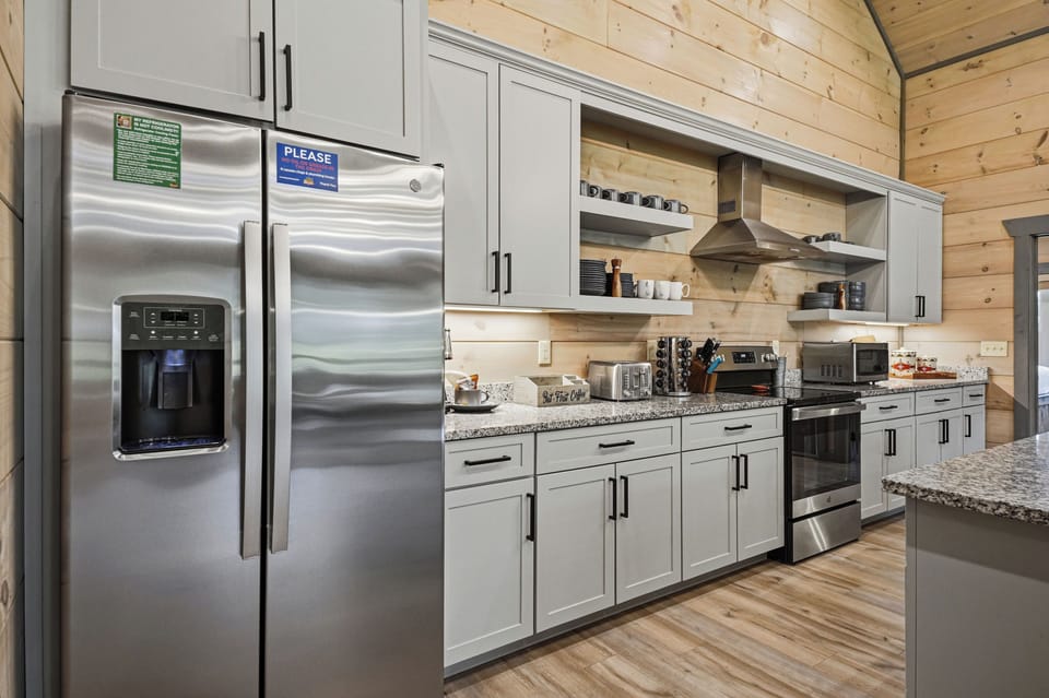 Fully equipped upper-level kitchen for family meals