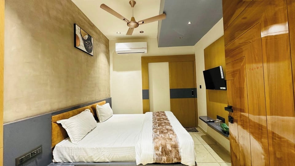 Deluxe Double Room, City View | In-room safe, desk, laptop workspace, iron/ironing board