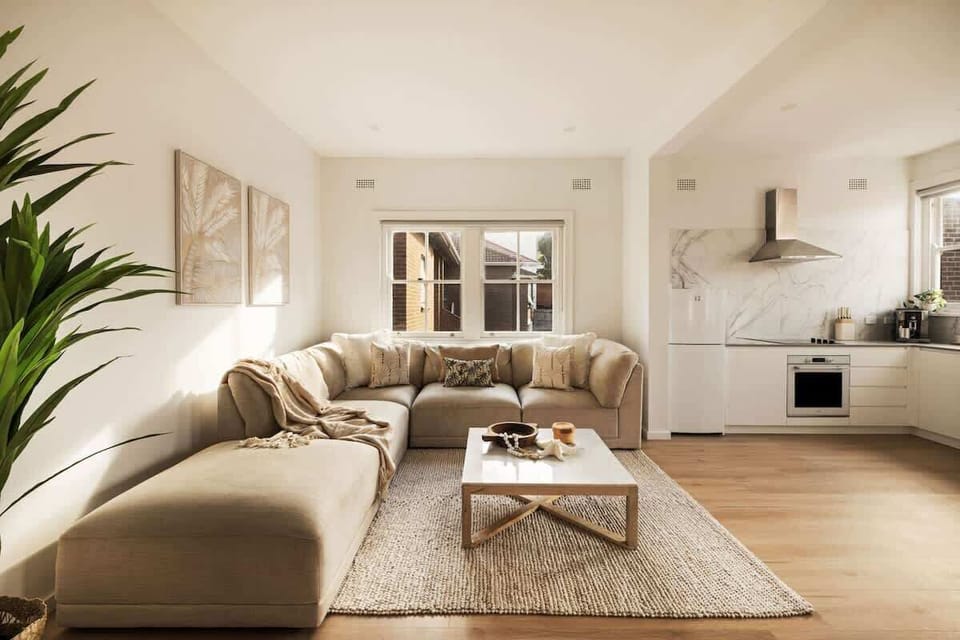 Living Room: Bright and airy space with lush greenery and elegant furnishings for delightful gatherings!