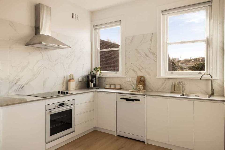 Kitchen Paradise: Sleek design with modern appliances and stunning natural light! Perfect for culinary adventures.