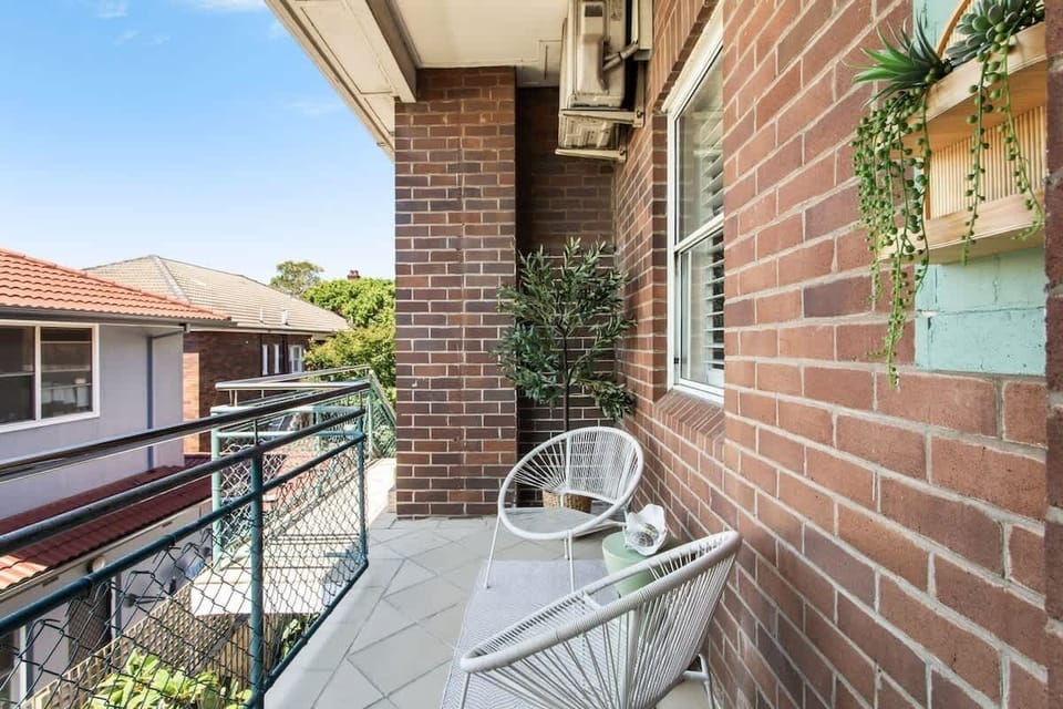 Balcony Retreat: Sip your morning coffee and prepare for a day at the beach!