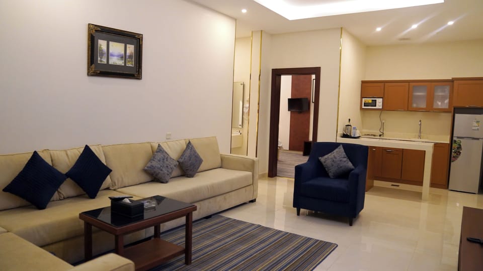 Luxury Suite | Living area | TV