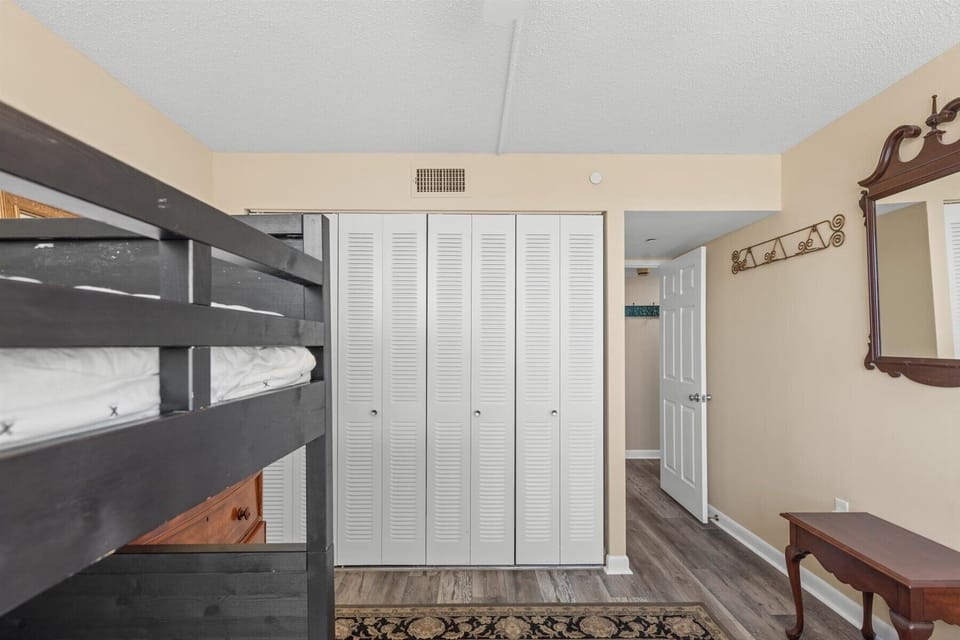 A functional layout featuring a large double-door closet for storage and easy access to the hallway.