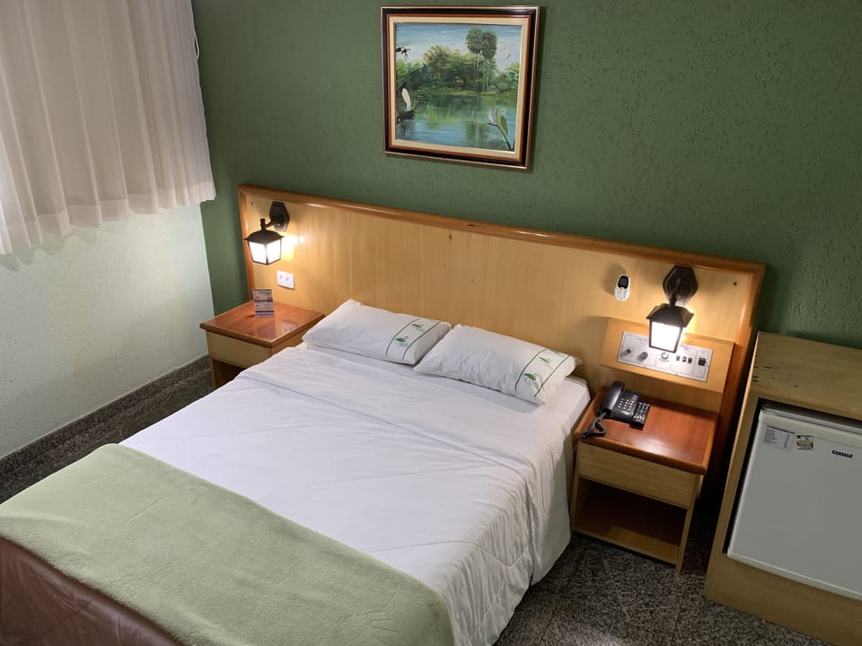Standard Double Room | Minibar, desk, blackout drapes, iron/ironing board