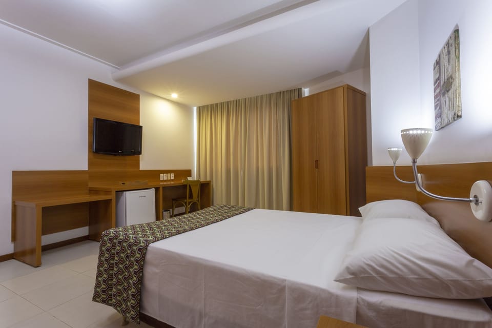 Standard Double Room | Minibar, desk, laptop workspace, blackout drapes