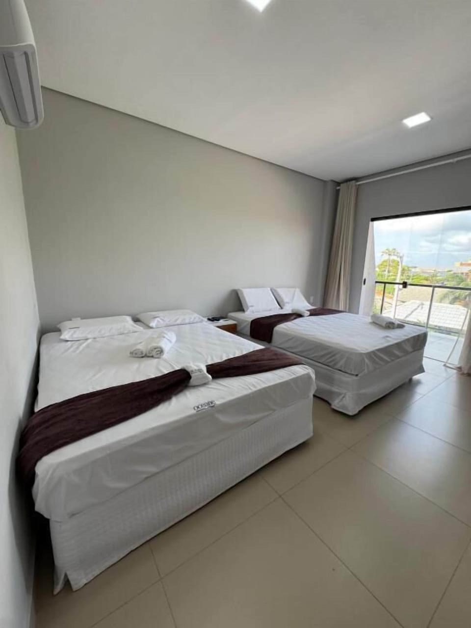 Quadruple Room, City View | Desk, laptop workspace, free WiFi, bed sheets