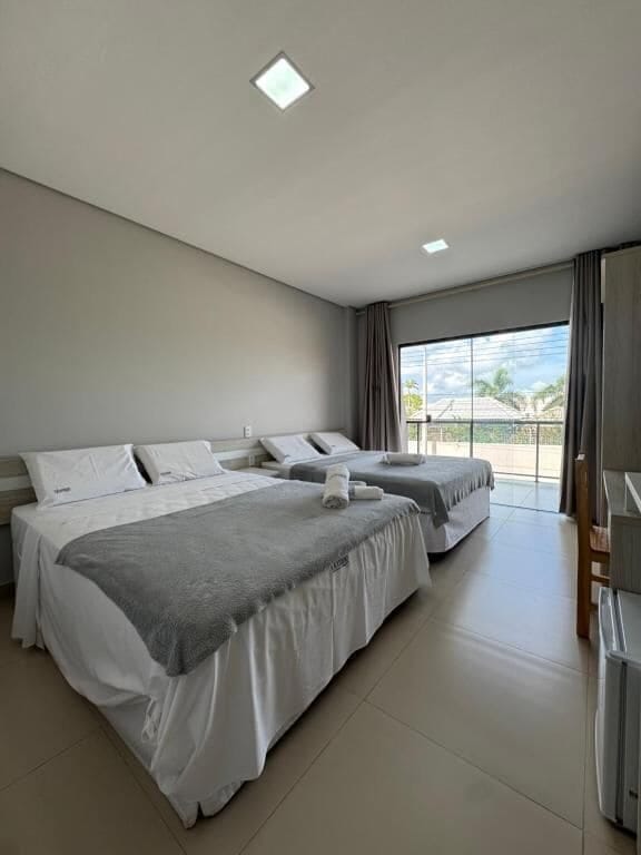 Quadruple Room, City View | Desk, laptop workspace, free WiFi, bed sheets