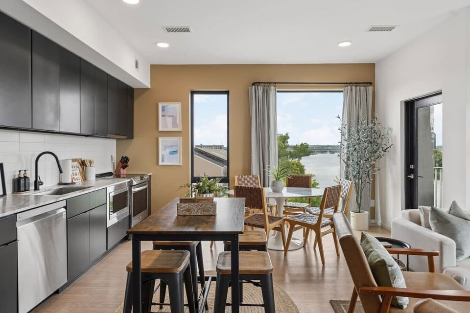 Our kitchen is fully equipped with high-end appliances and two dining areas. Private balcony off of this area to enjoy your morning coffee.