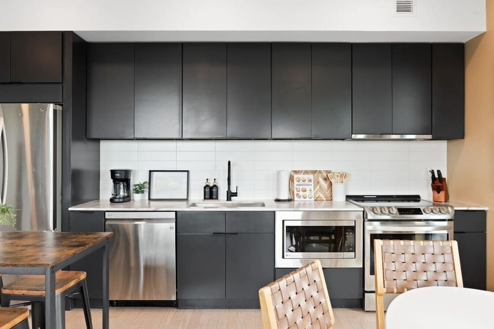 Our kitchen is fully equipped with high-end appliances and two dining areas. Private balcony off of this area to enjoy your morning coffee.