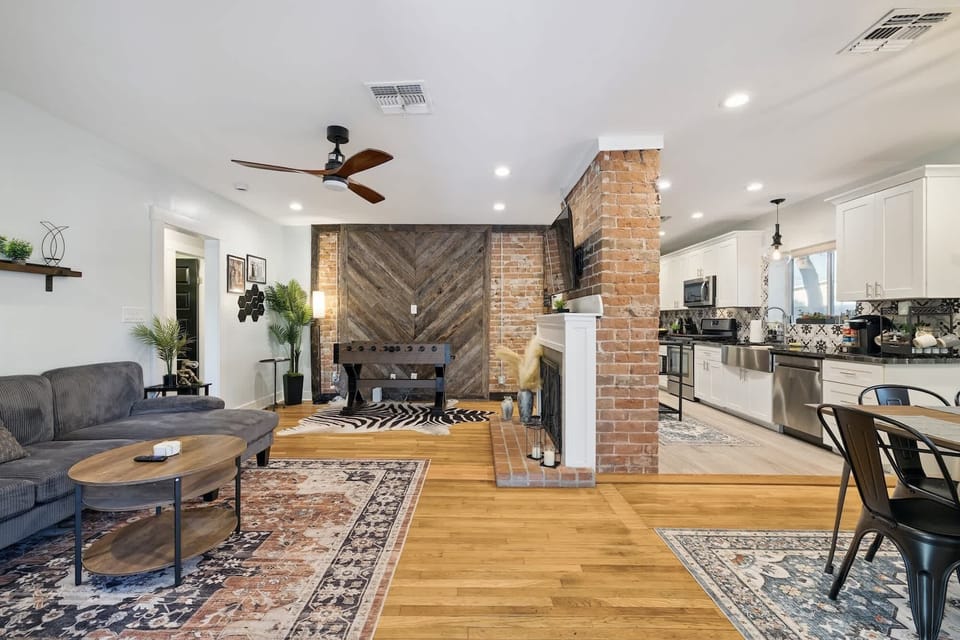Enjoy a social getaway in our open-concept living area! The seamless flow between the kitchen, dining, and lounge means you're always part of the action. Cook, play foosball, or relax on the sectional while staying connected.