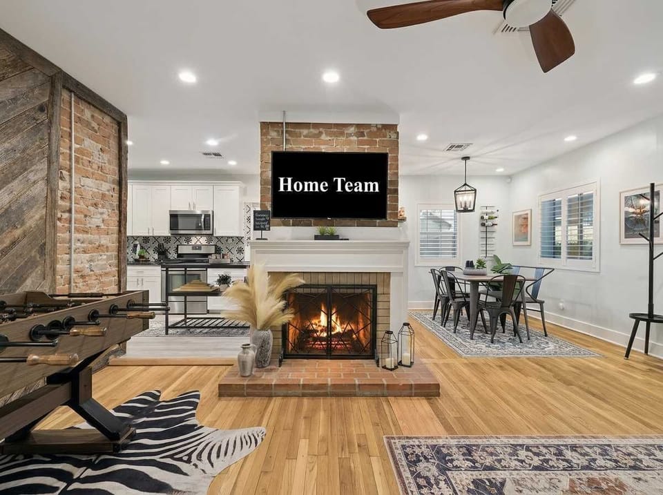 Cozy up by our stunning brick fireplace! This central feature adds warmth and charm to our open living space, making it the perfect spot to gather for a movie night or a relaxing evening after a day of exploring.