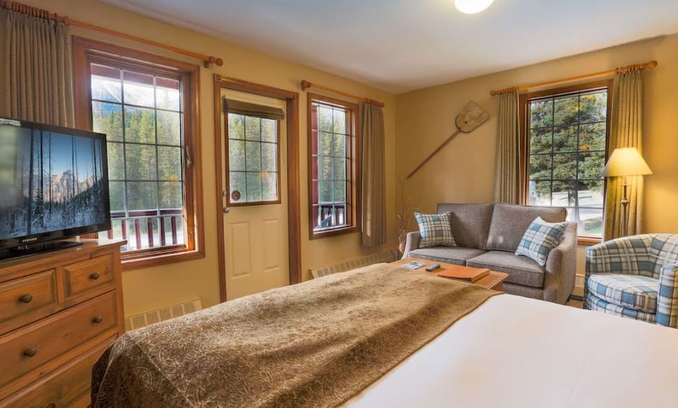 Unwind on the couch or enjoy mountain vistas from this inviting seating area.
