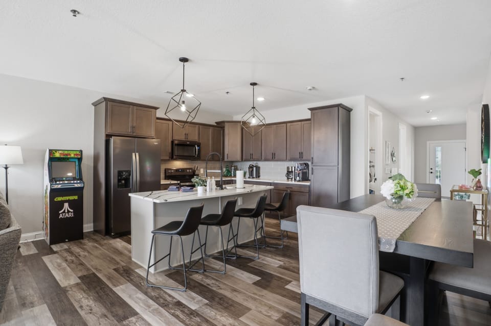 The open kitchen and dining area is focused on connecting and fun with some classic arcade options.