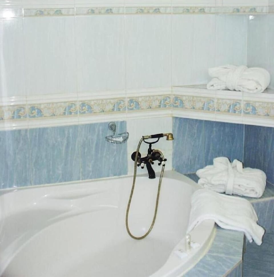 Bathtub, hair dryer, towels