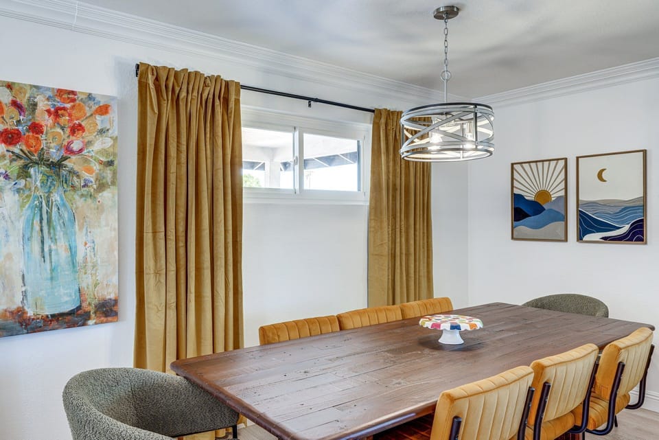 Gather around the elegant dining table, accented by art and mood lighting, for memorable meals together.
