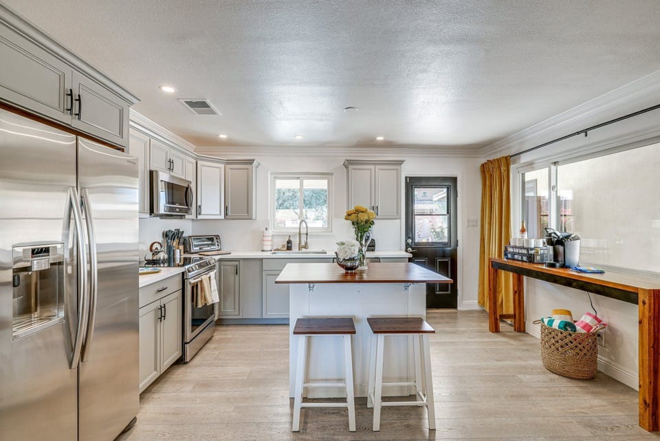 Cook up a feast in this modern kitchen equipped with stainless steel appliances and ample counter space.