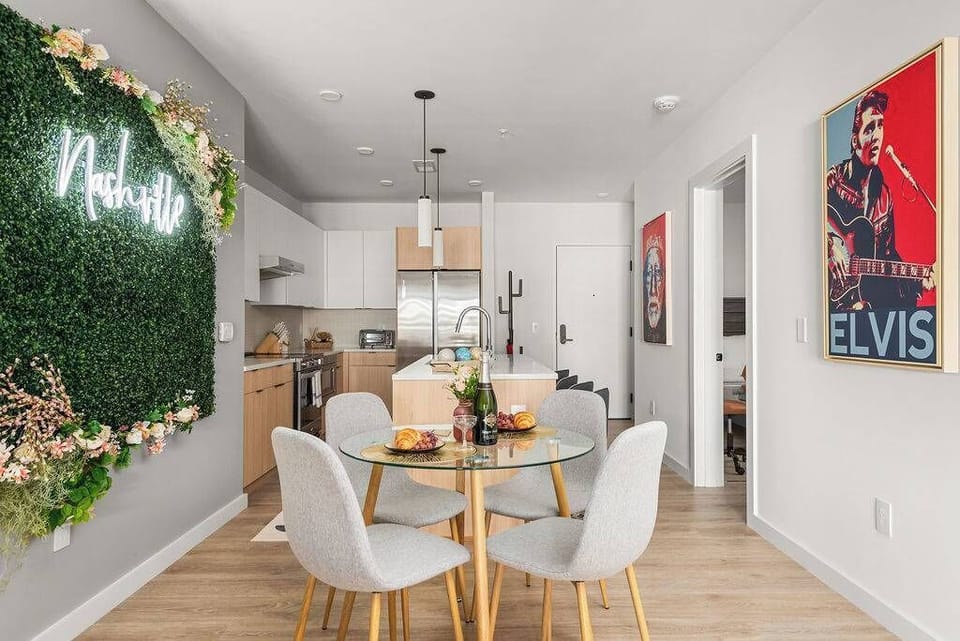 Bright and airy dining area with comfortable seating and open access to the modern kitchen