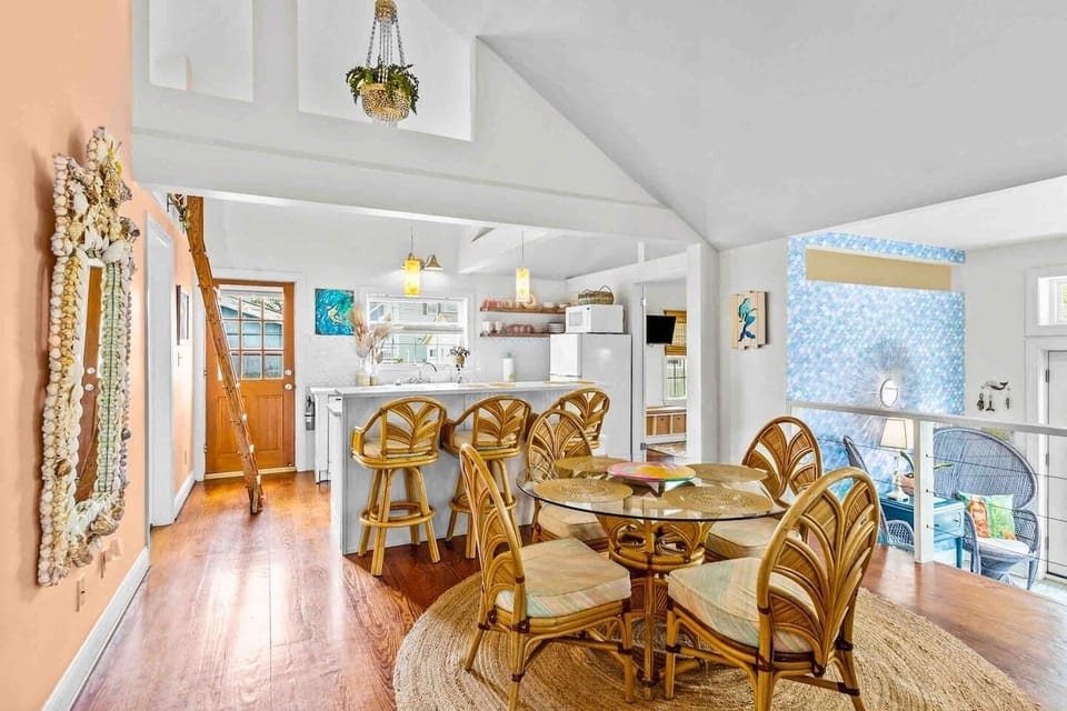 Plenty of dining space for the whole family!  (6 dining chairs, 3 barstools and a portable highchair at request.)
