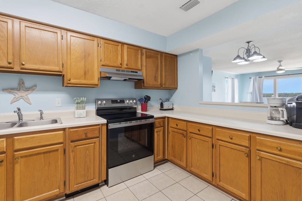 full size kitchen with new appliances, and cookware  
