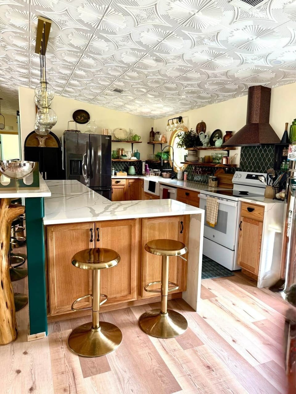 A fully equipped kitchen with a large fridge, filtered water, and an ice maker, the Sanctuary is ready for culinary magic. 
Exquisite dishware (for up to 30) elevates every meal. An L-shaped bar feeds 6 to 8, while a modern oval table seats 6-8 more.
