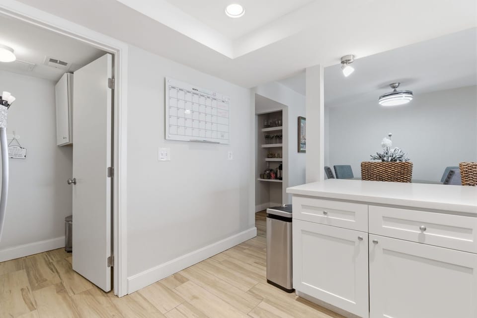 Gather in the bright, open kitchen with stainless steel appliances and a breakfast bar, perfect for morning coffee, easy meals, and happy-hour bites.