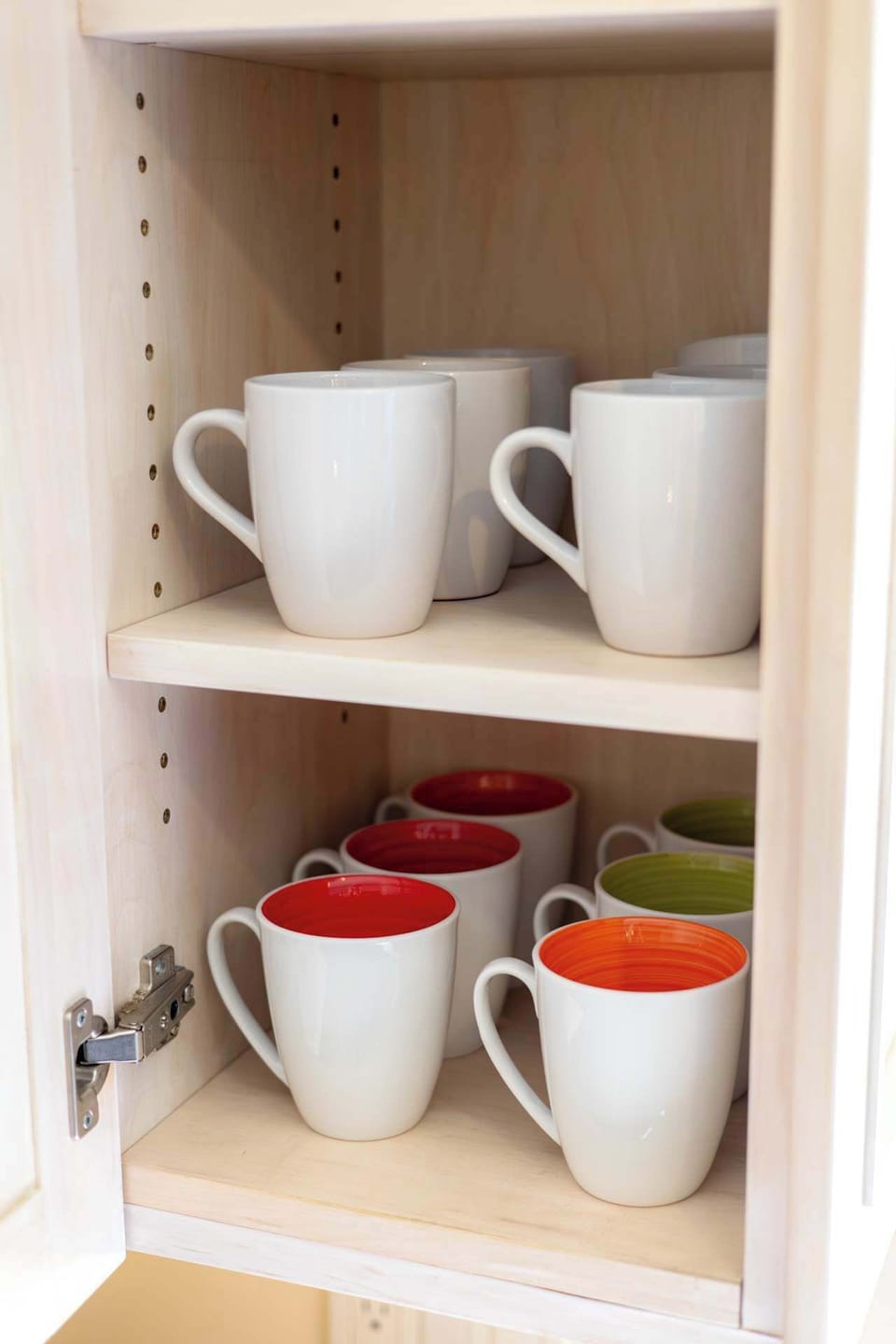 Open shelving with mugs and kitchen essentials, adding convenience for coffee and tea lovers.