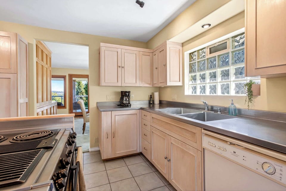 Bright modern kitchen with generous cabinetry, ample prep space, and a practical layout for longer stays.