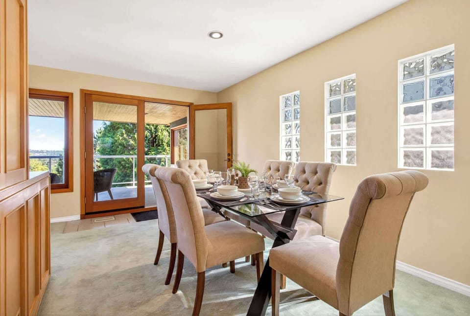 Spacious dining room with elegant seating and plenty of natural light for family meals or entertaining.