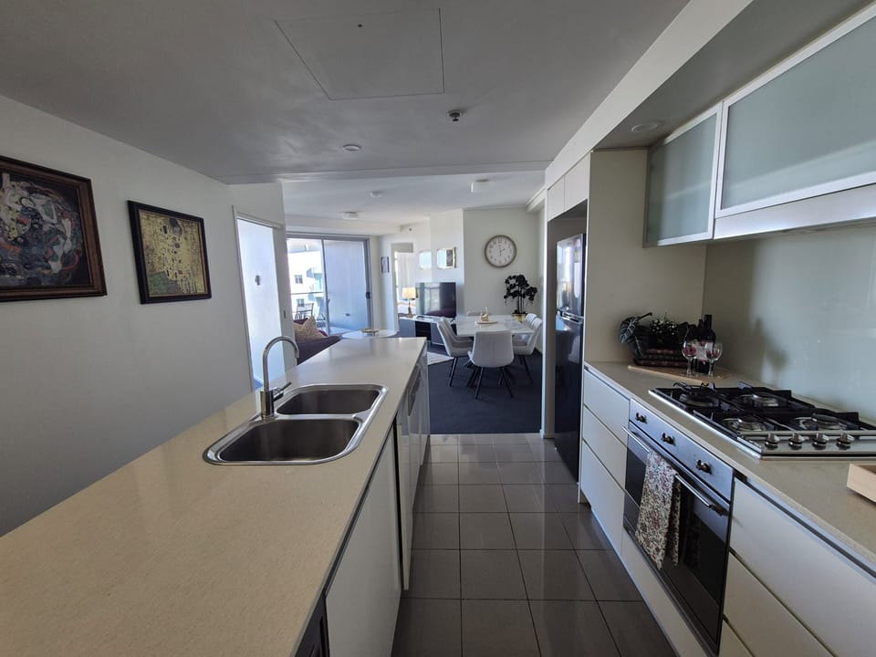 Deluxe Apartment, River View | Private kitchen | Espresso maker, coffee/tea maker, electric kettle, highchair