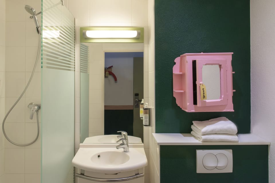 Shower, eco-friendly toiletries, hair dryer, towels
